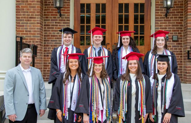 2024 McCollough Scholars graduates with Dr. Ted Poston on the steps of Clark Hall